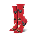 Pair of crew socks with chicken pattern on a red background.
