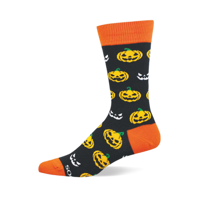Crew sock with black background, orange cuff, heel, and toe, patterned with yellow jack-o'-lanterns and white spooky faces.
