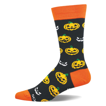 Crew sock with black background, orange cuff, heel, and toe, patterned with yellow jack-o'-lanterns and white spooky faces.