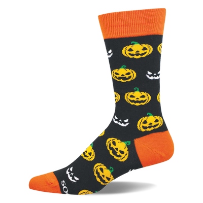 Crew sock with black background, orange cuff, heel, and toe, patterned with yellow jack-o'-lanterns and white spooky faces.