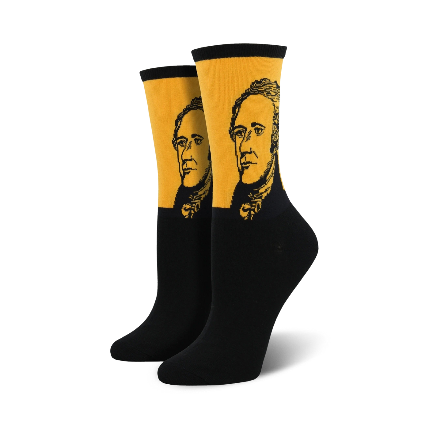 Pair of black and gold crew socks featuring a portrait of Alexander Hamilton. The socks have a mustard yellow band with a black and white illustration of Hamilton's face.