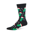 Festive black Christmas pickle sock with a pattern of green pickles wearing Santa hats and falling white snowflakes.