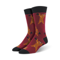 Pair of maroon crew socks with a repeating pattern of brown bears lifting weights.  Black cuffs.