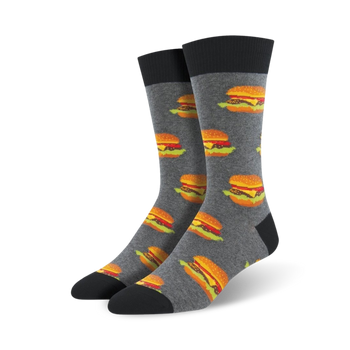 gray crew socks featuring a pattern of classic hamburgers with brown buns, green lettuce, orange cheese, and red ketchup. made for men.   