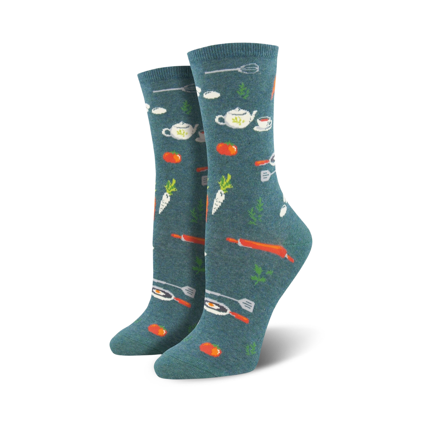 A pair of women's crew socks in teal with a whimsical pattern of orange carrots, tomatoes, teapots, and kitchen utensils.