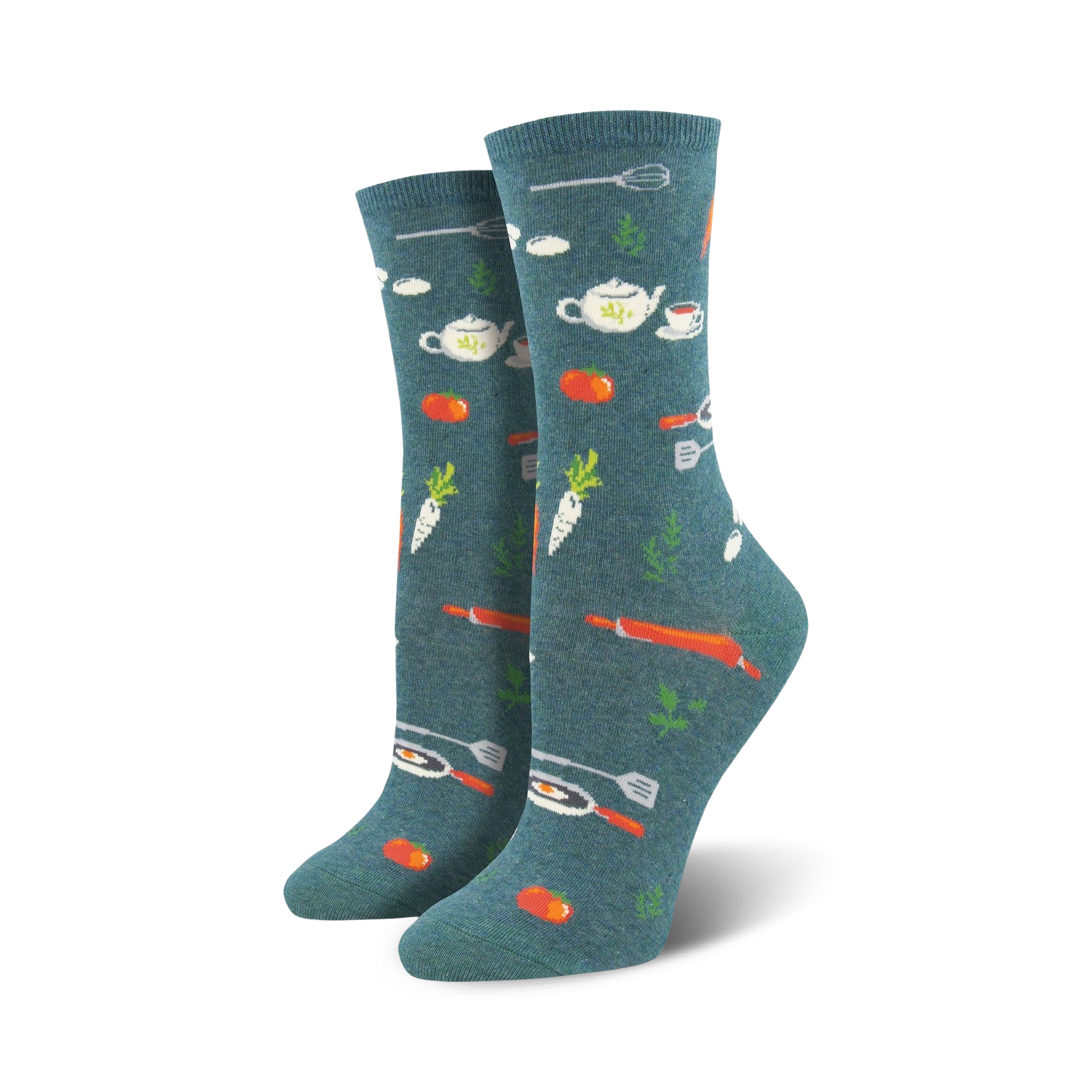 A pair of women's crew socks in teal with a whimsical pattern of orange carrots, tomatoes, teapots, and kitchen utensils.