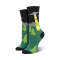 Crew socks in teal, black, and lime green.  Design features an alien abduction scene with a UFO, trees, and mountains against a night sky.