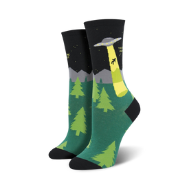 black and green crew socks for women feature a spaceship abducting a screaming person.  