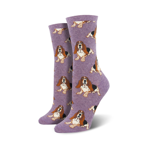Pair of women's crew socks featuring a repeating pattern of basset hounds in brown, white, and black against a lavender background.