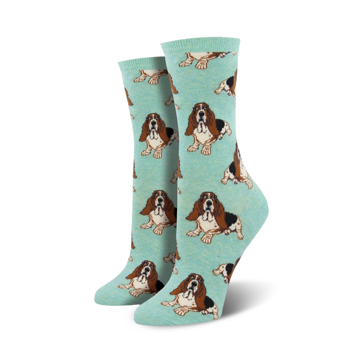 Pair of teal women's crew socks with a repeating basset hound pattern. Lifestyle shot showing the socks on a model's feet.