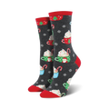 Pair of women's crew socks in dark gray with a festive design of hot cocoa cups, candy canes, and snowflakes. Red and green accents.