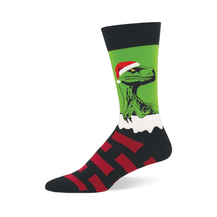 Raptor Claus sock featuring a green raptor in a Santa hat peeking over white fluff, with a black and red striped foot. }}