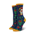 A pair of women's crew socks in navy blue. The socks feature a pattern of green sugar skulls, red roses, and a portrait of Frida Kahlo styled as a Catrina.