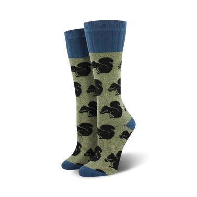 dark blue top, light olive green body. pattern of black squirrels. mid-calf length. womens. boot. outdoor theme.   