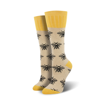 white boot socks with a black bee pattern, yellow top, and a women's size: 5-10.  