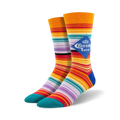 Pair of crew socks with multicolor stripes in orange, red, purple, and teal, featuring a Corona Extra logo.