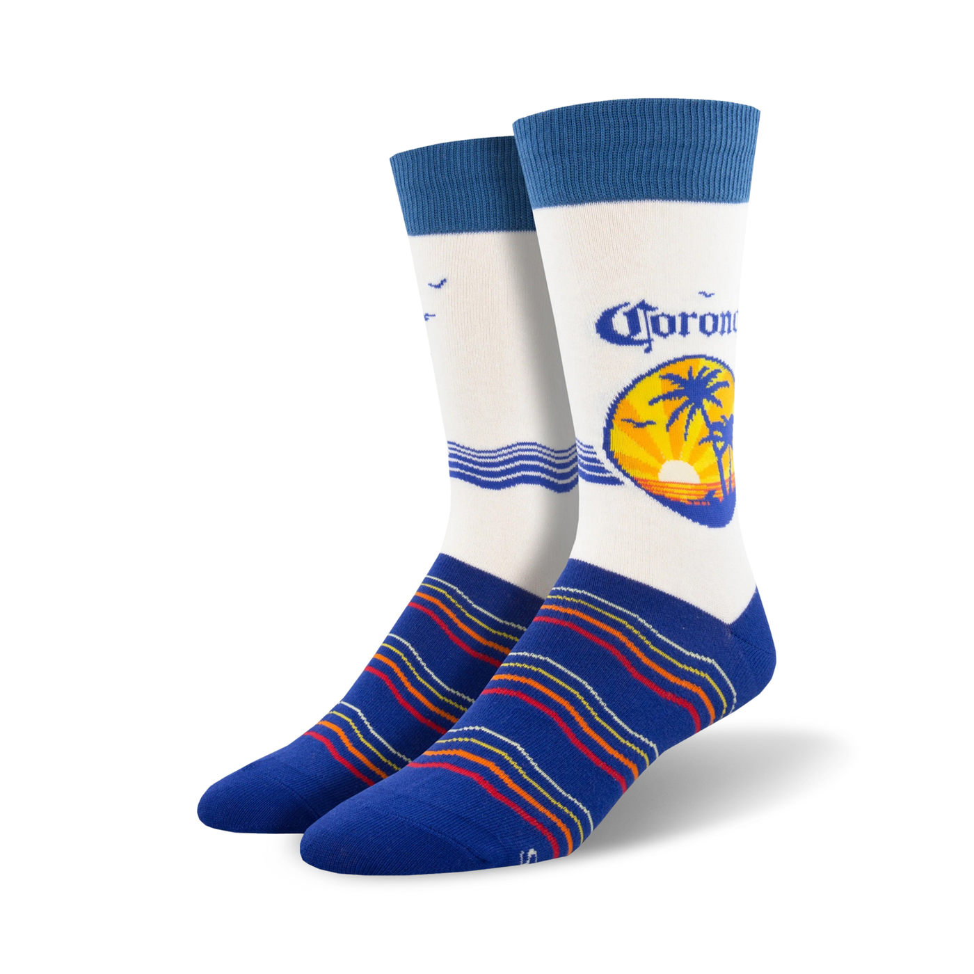 Pair of crew socks; predominantly white with a Corona beer logo featuring a palm tree sunset; blue stripes at the bottom; blue cuffs.