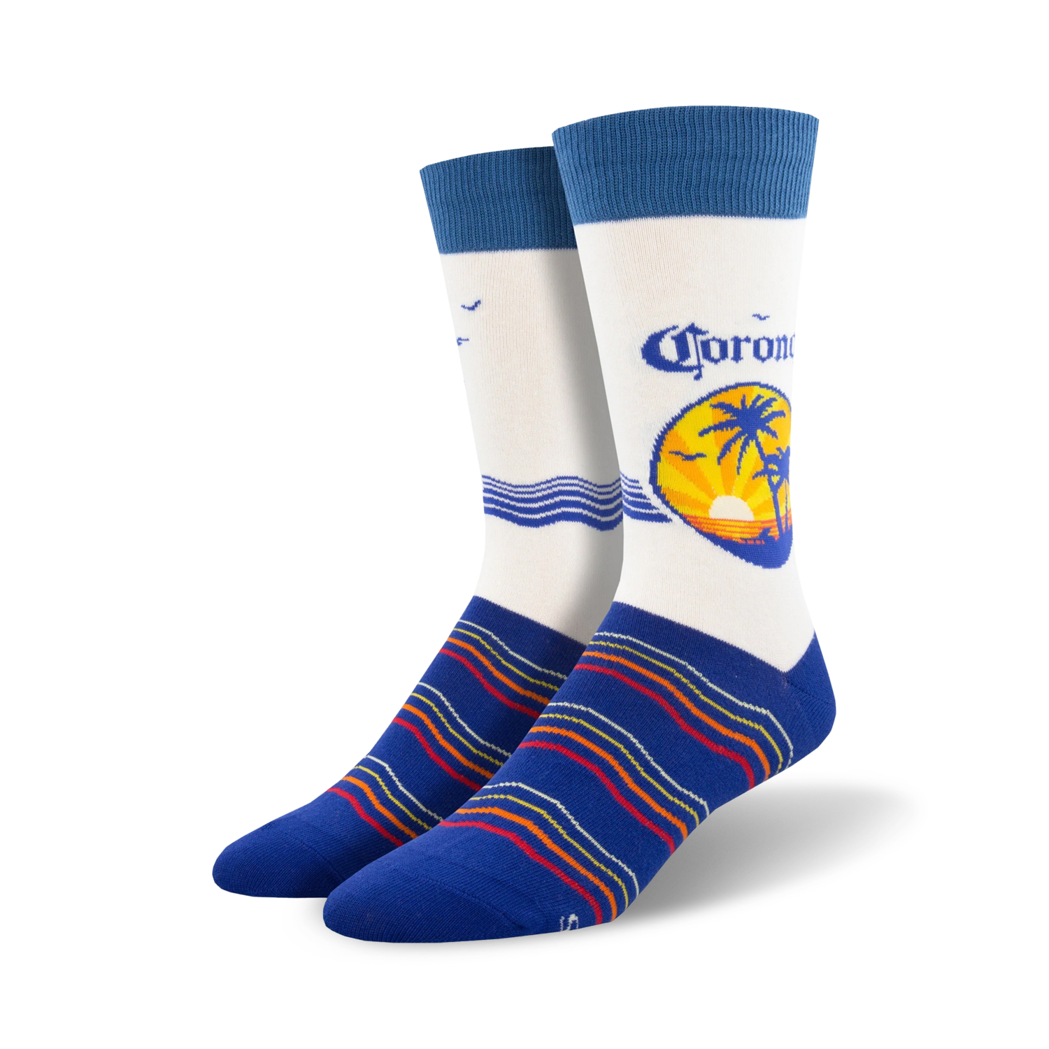 Pair of crew socks; predominantly white with a Corona beer logo featuring a palm tree sunset; blue stripes at the bottom; blue cuffs.