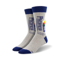 Pair of grey crew socks with a navy blue cuff.  The socks feature a retro-style Pacifico beer bottle graphic.