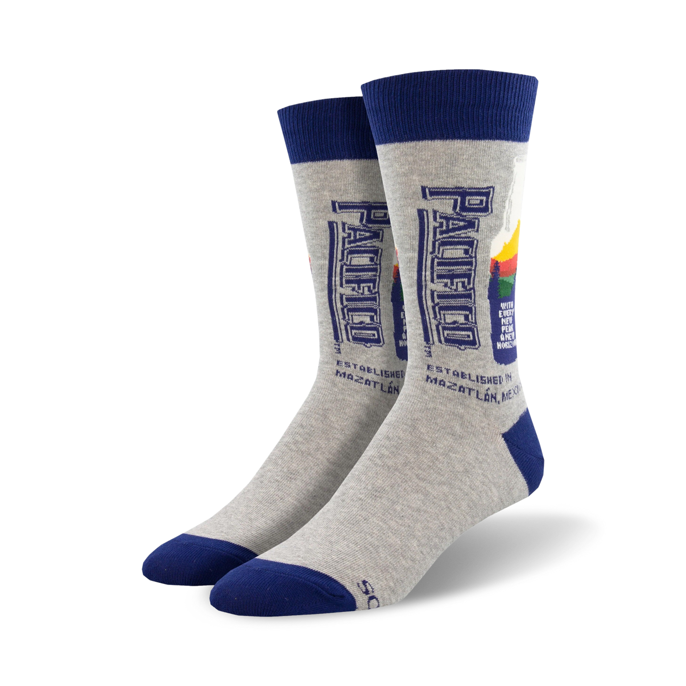 Pair of grey crew socks with a navy blue cuff.  The socks feature a retro-style Pacifico beer bottle graphic.
