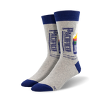 Pair of grey crew socks with a navy blue cuff.  The socks feature a retro-style Pacifico beer bottle graphic.