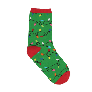 A single green crew sock with a repeating pattern of colorful Christmas lights on black wires, featuring red cuff, heel, and toe.