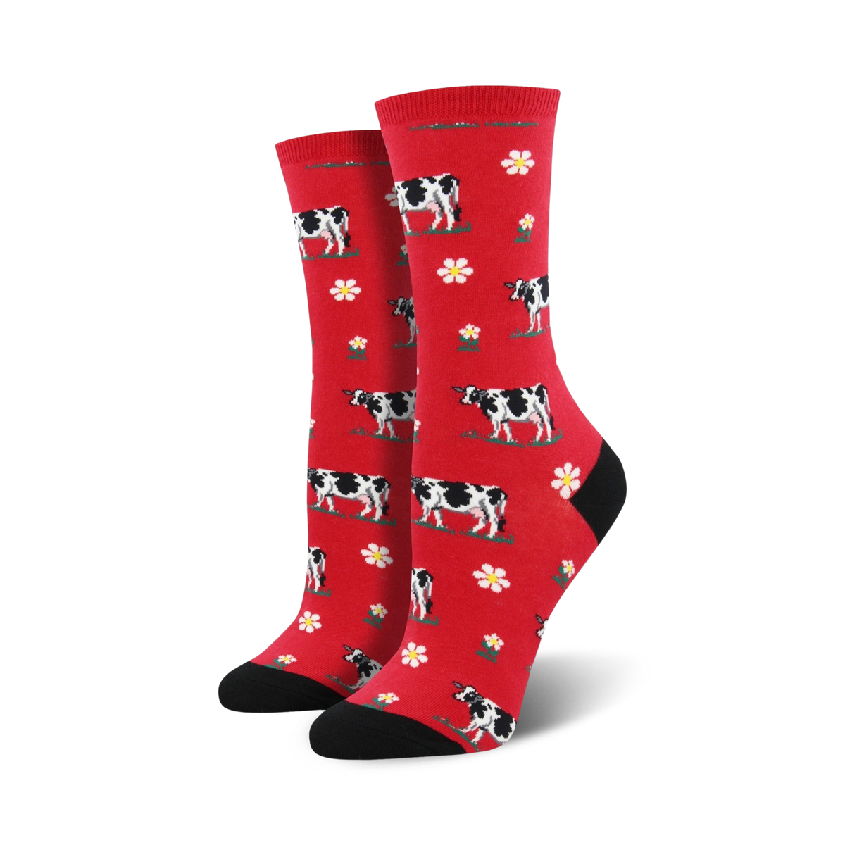 Pair of crew socks; red background with black and white cows and white flowers.  Black heel and toe.