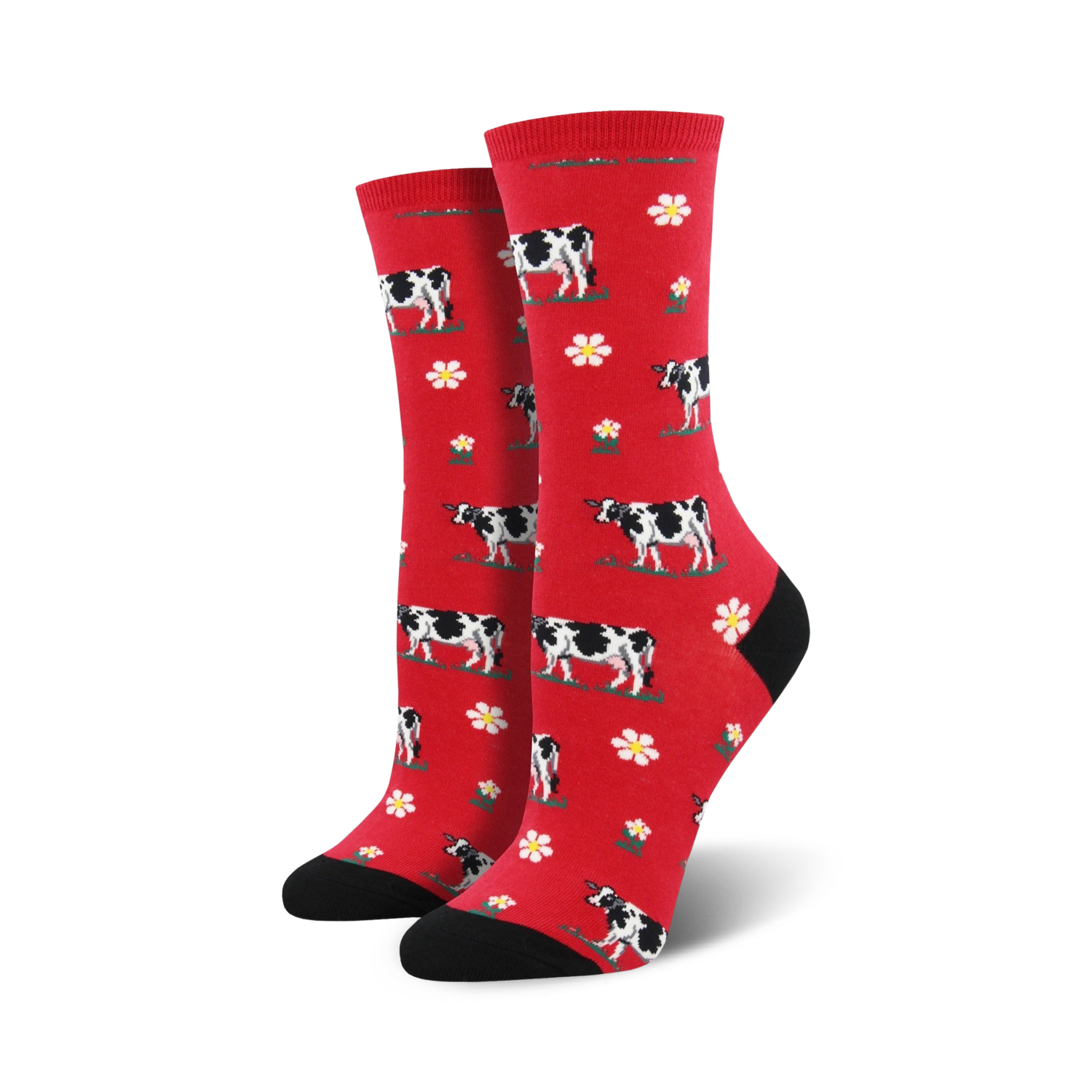 Pair of crew socks; red background with black and white cows and white flowers.  Black heel and toe.
