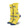 Lifestyle shot showing the yellow cow socks on a person's feet