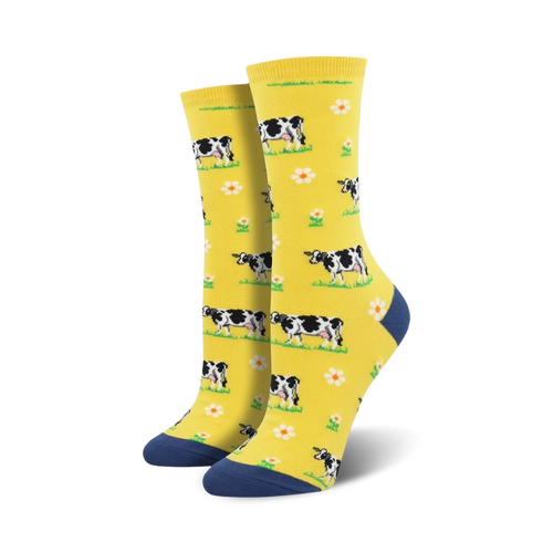 Lifestyle shot showing the yellow cow socks on a person's feet