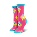 Crew socks in pink with a teal cuff, featuring a repeating pattern of dogs wearing snorkeling gear and inner tubes.