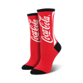 Pair of red crew socks with a white Coca-Cola logo. Black accents at the toe and cuff.