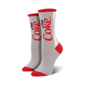 Pair of gray crew socks with a red and white Diet Coke logo design. Red accents at the toe and heel.