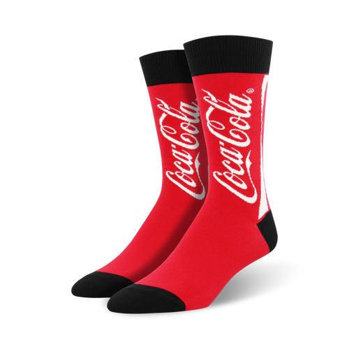 coca-cola socks in crew length, made for men with red color and a black toe/heel. the word coca-cola is splashed across the front in white.  