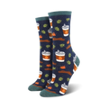 Crew socks in navy blue with a pattern of pumpkin spice lattes, cinnamon sticks, and autumn leaves. Teal-colored cuffs.