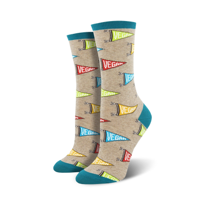 crew-length women's socks with a light beige background and a repeating pattern of multicolor triangular pennant flags with the word "vegan" on them in a fun food & drink theme.  