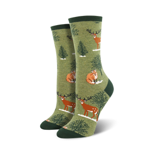 womens crew socks in dark green with a pattern of foxes and deer in a snowy forest.  