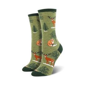 womens crew socks in dark green with a pattern of foxes and deer in a snowy forest.  