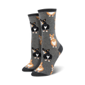 Lifestyle shot:  A person's feet showing off the gray Corgi Butt socks. 