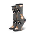 Lifestyle shot:  A person's feet showing off the gray Corgi Butt socks. 