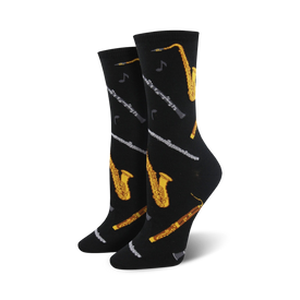 black crew socks with gold and silver musical instruments, including saxophones, clarinets, and flutes. designed for women who love music.    