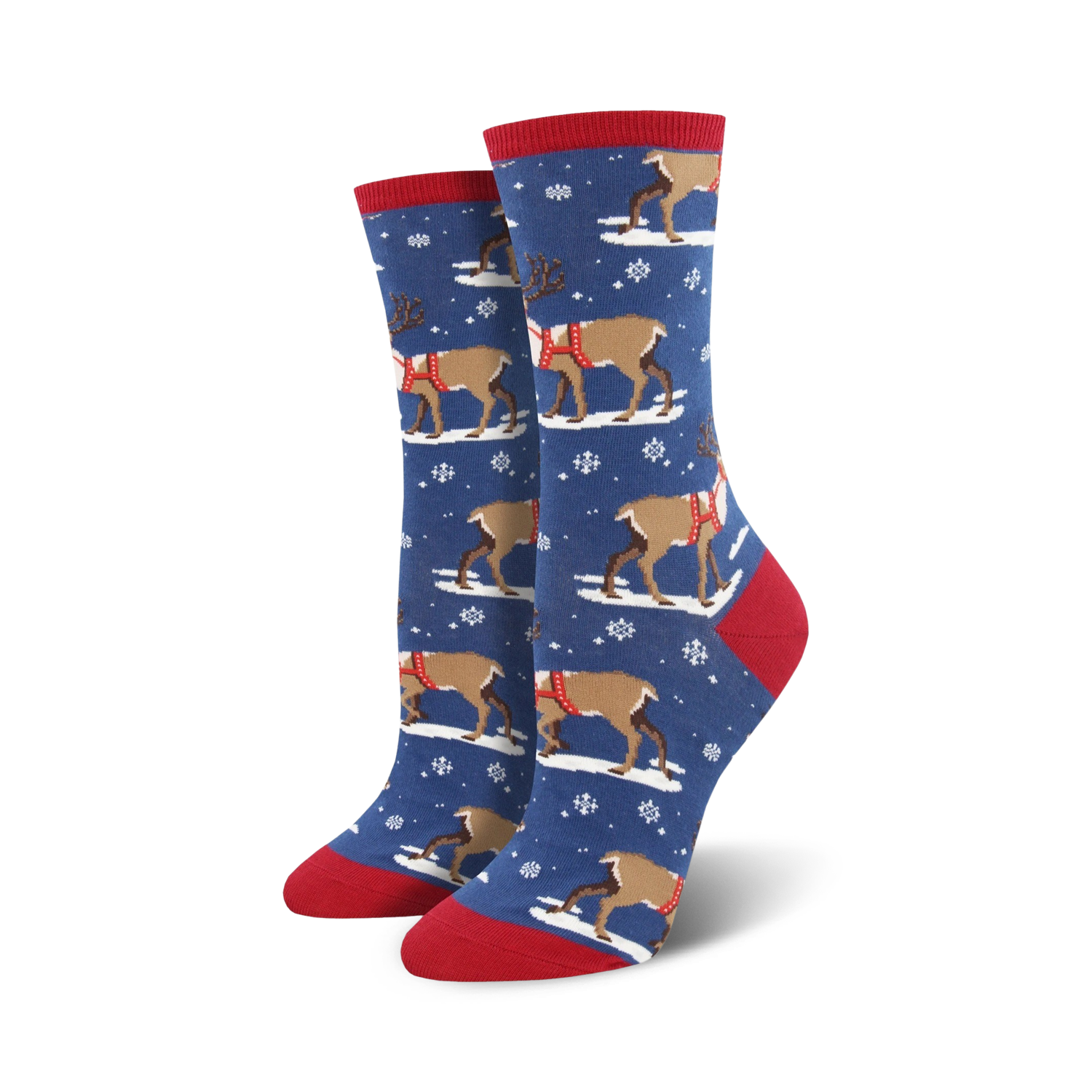 Pair of crew socks, blue and red, with a pattern of reindeer wearing harnesses and snowflakes on a dark blue background.