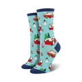 Pair of crew socks in teal and navy blue. Features a pattern of red camper vans decorated for Christmas, snowmen, and pink flamingos.