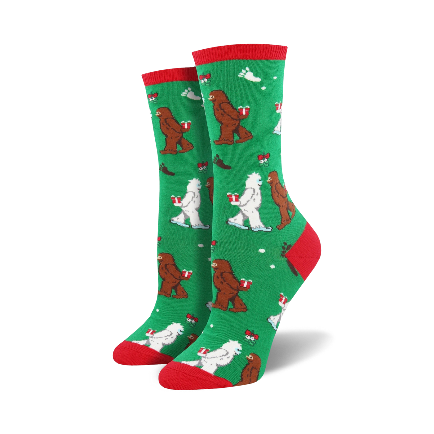 Close-up of a green Mythical Kissmas sock with red cuff, showing the Bigfoot and Yeti design detail.