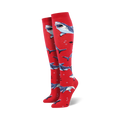 Pair of red knee-high socks with a pattern of gray sharks and small bubbles.  Fun and playful design.