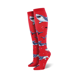 red crew socks with a pattern of blue & white cartoon sharks.  
