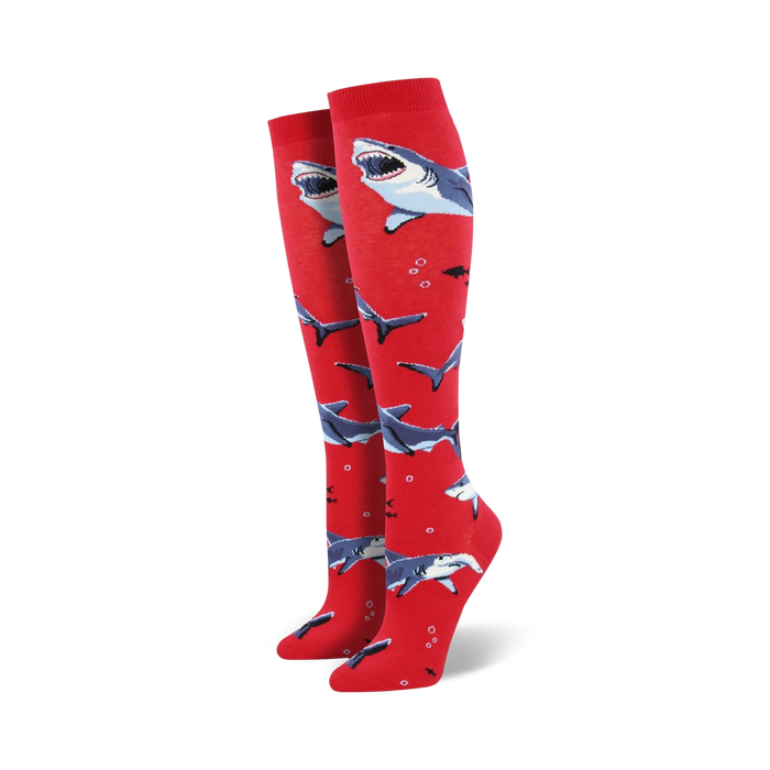 red crew socks with a pattern of blue & white cartoon sharks.   }}