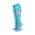 Pair of women's knee-high socks. Light blue background with white and pink pegasus designs and white clouds.