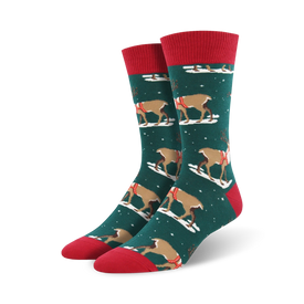 dark green crew socks with a festive pattern of reindeer in red and white saddles prancing on a snowy white background. perfect for the holidays!  