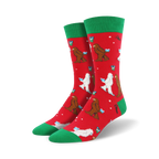 Crew socks in red with green cuffs.  The design features Bigfoot and Yeti figures exchanging gifts in a playful Christmas scene.